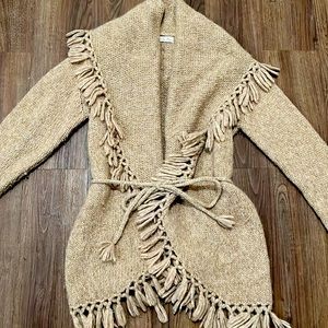 LoveShackFancy cable-knit sweater.